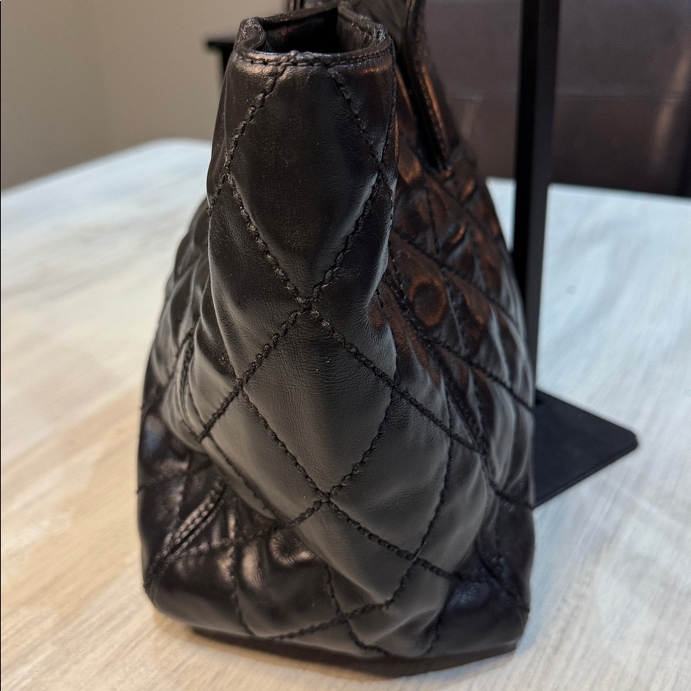 CHANEL Black Quilted Handbag with Gold Accent - Picture 3 of 13